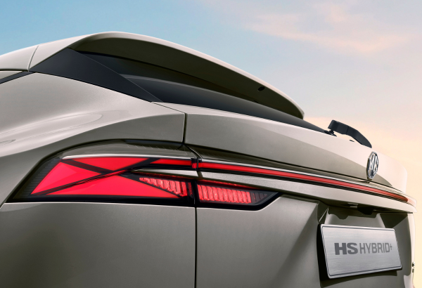 Close-up of a MG HS Hybrid Plus rear with illuminated tail light.